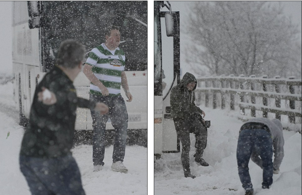 Celtic football fans on their way to watch their team play Inverness Caledonian Thistle stop off on the side of the A9 to play in the snow