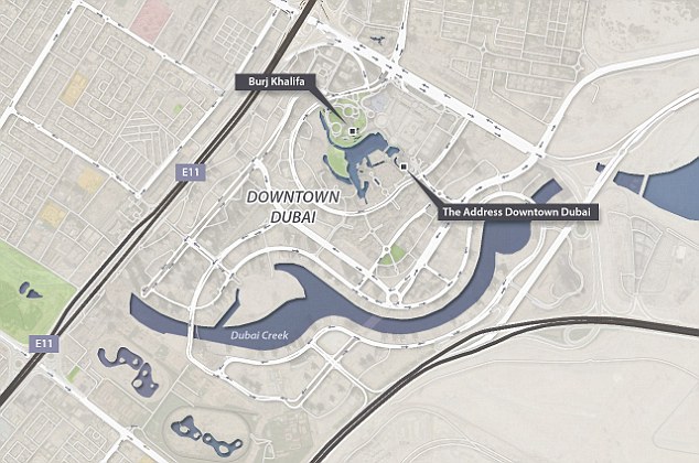 Debris flies off Dubai building as massive fire rips through