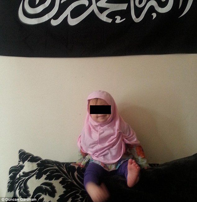 Age SIX and groomed for jihad in British suburbia: Shocking image of UK extremism, taken by little boy's Muslim convert father