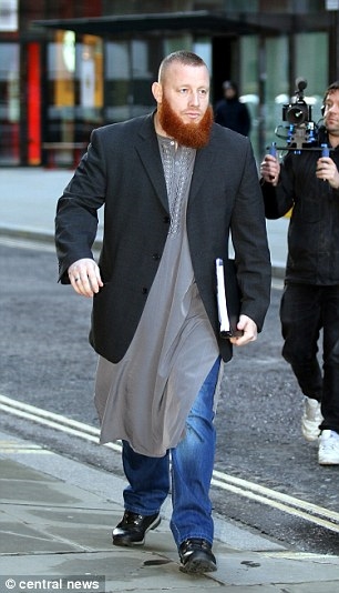 Age SIX and groomed for jihad in British suburbia: Shocking image of UK extremism, taken by little boy's Muslim convert father