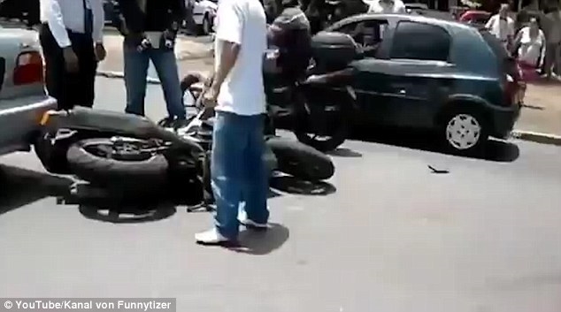 Shocking video- hows woman driver smashing motorcyclist ramming road parked cars kicked vehicle Shocking video- hows woman driver smashing motorcyclist ramming road parked cars kicked vehicle