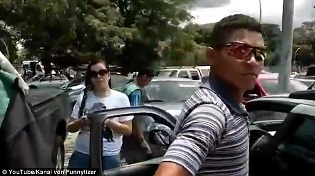 Shocking video- hows woman driver smashing motorcyclist ramming road parked cars kicked vehicle Shocking video- hows woman driver smashing motorcyclist ramming road parked cars kicked vehicle