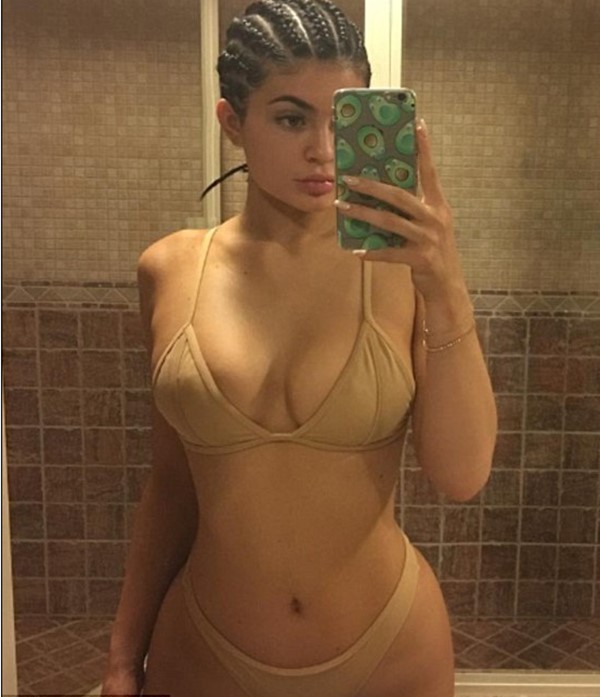 Nearly nude! Kylie Jenner dons flesh-coloured bikini to go with her braided hair in another revealing selfie