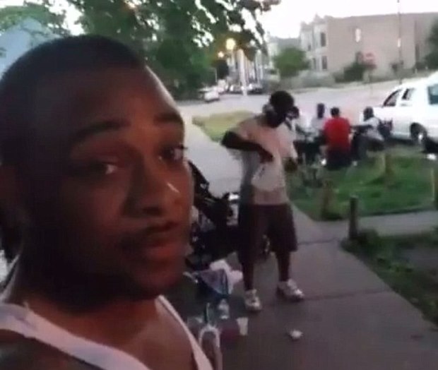 Terrifying moment a Chicago 'gang member', 28, unwittingly streams his own shooting death on Facebook