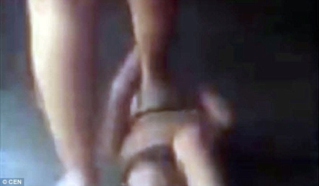 Mother sparks outrage after she is filmed punishing her young boy by standing on his chest so hard he can't cry out in Guatemala 