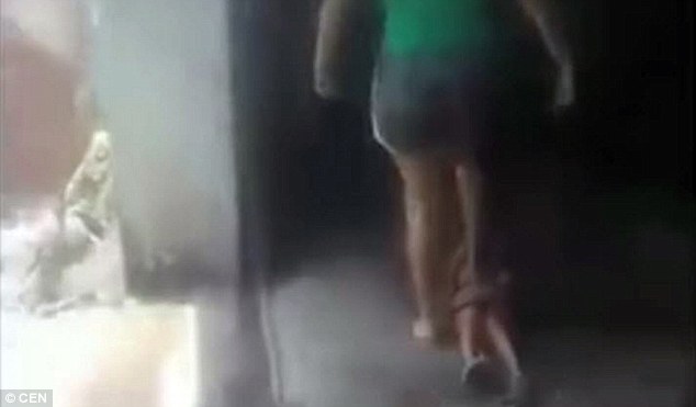 Mother sparks outrage after she is filmed punishing her young boy by standing on his chest so hard he can't cry out in Guatemala 