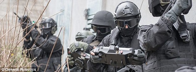 The tiny drone tank packing a pistol: Israeli 'combat robot' has its own remote controlled Glock to shoot at enemies