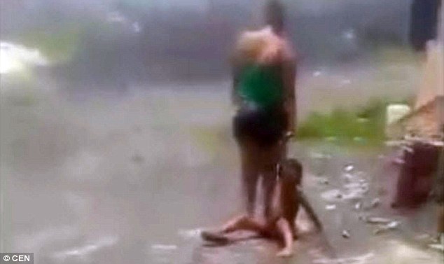 Mother sparks outrage after she is filmed punishing her young boy by standing on his chest so hard he can't cry out in Guatemala 