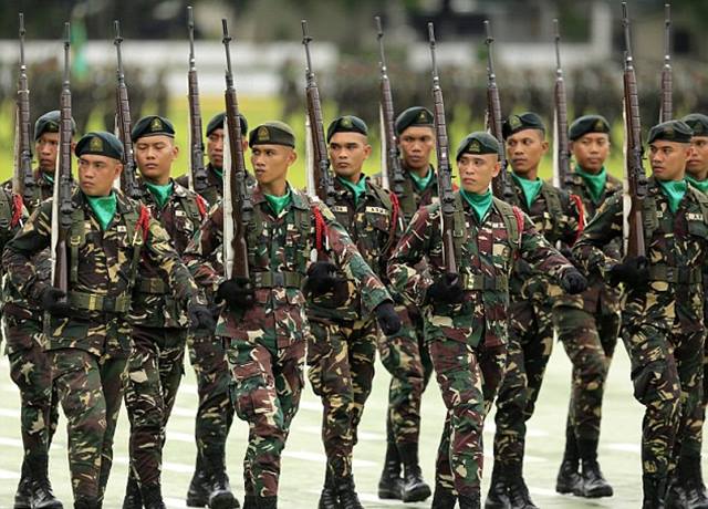 British clergyman known as 'Vicar of Baghdad' suspended by charity after claims he was involved in paying ransoms to buy back sex slaves from Islamic State