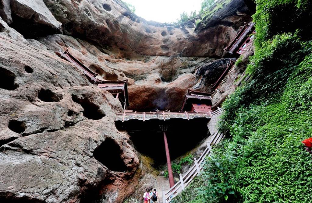 Temple of doom: Worshippers at Chinese holy site better watch their feet as it's carved into a 260ft cliff face