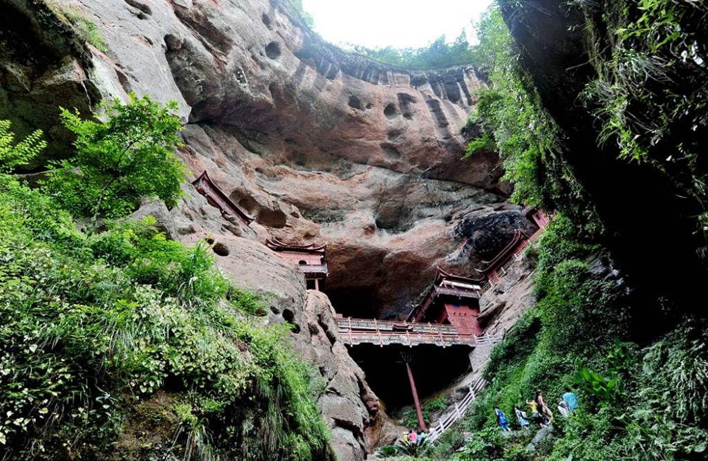 Temple of doom: Worshippers at Chinese holy site better watch their feet as it's carved into a 260ft cliff face