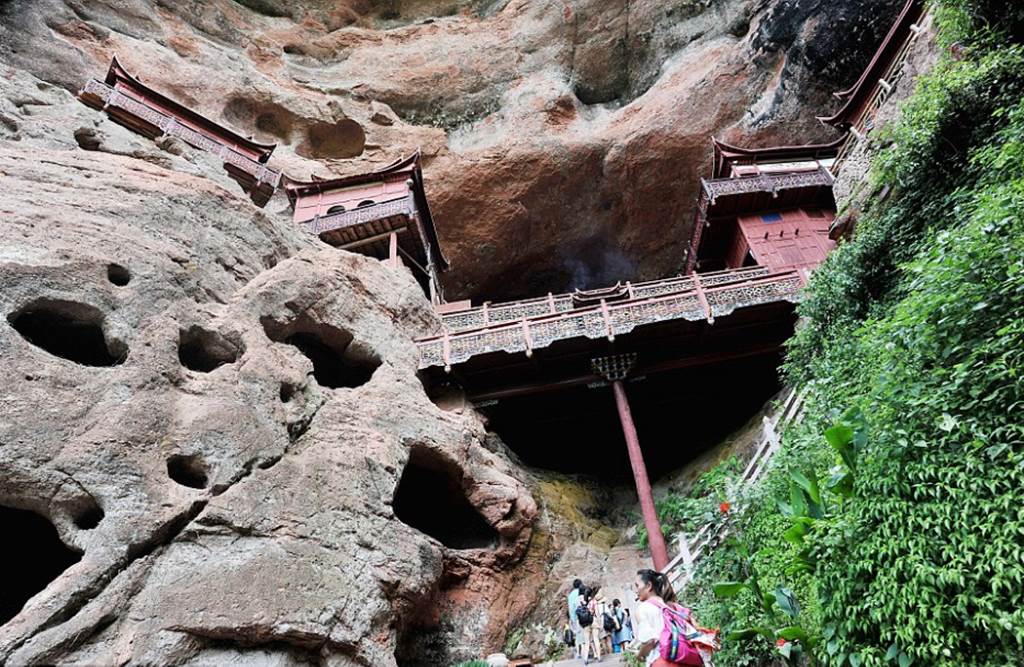 Temple of doom: Worshippers at Chinese holy site better watch their feet as it's carved into a 260ft cliff face