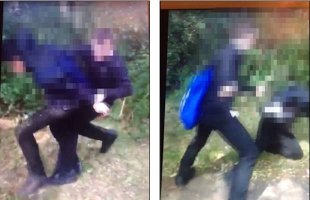 Racist attack: Vile video shows school pupils punching and kicking boy to the ground