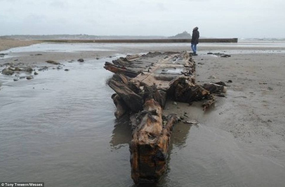 Calamity castle: Queen's neighbour flees 450-year-old home next to Balmoral which was left teetering on brink by rising flood waters as storms uncover 130-year-old ship wreck off Cornish coast