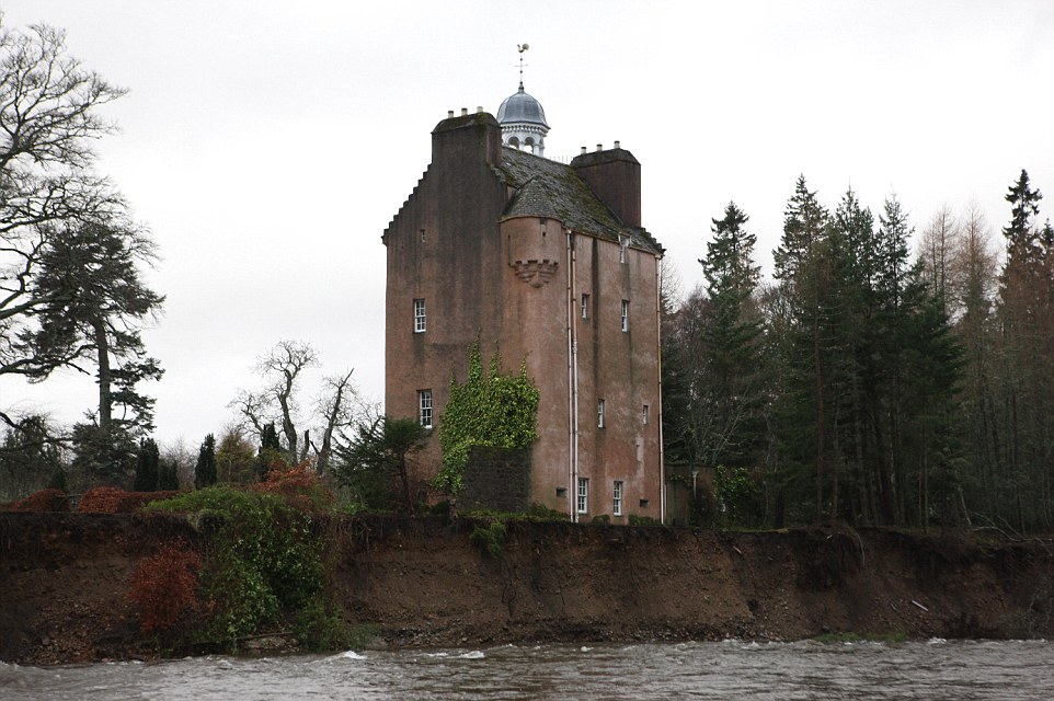 Calamity castle: Queen's neighbour flees 450-year-old home next to Balmoral which was left teetering on brink by rising flood waters as storms uncover 130-year-old ship wreck off Cornish coast