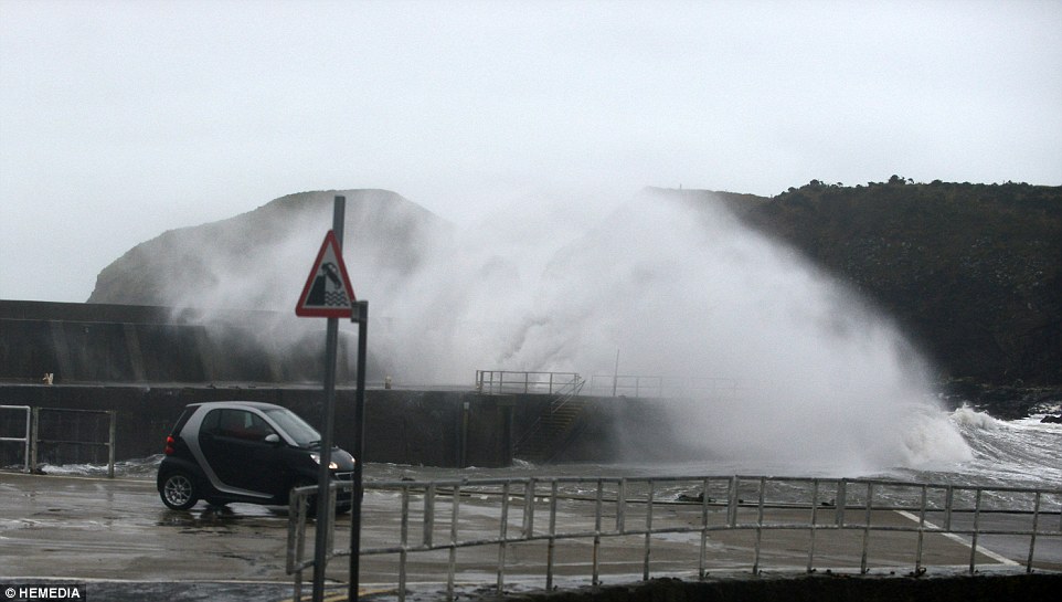 Calamity castle: Queen's neighbour flees 450-year-old home next to Balmoral which was left teetering on brink by rising flood waters as storms uncover 130-year-old ship wreck off Cornish coast