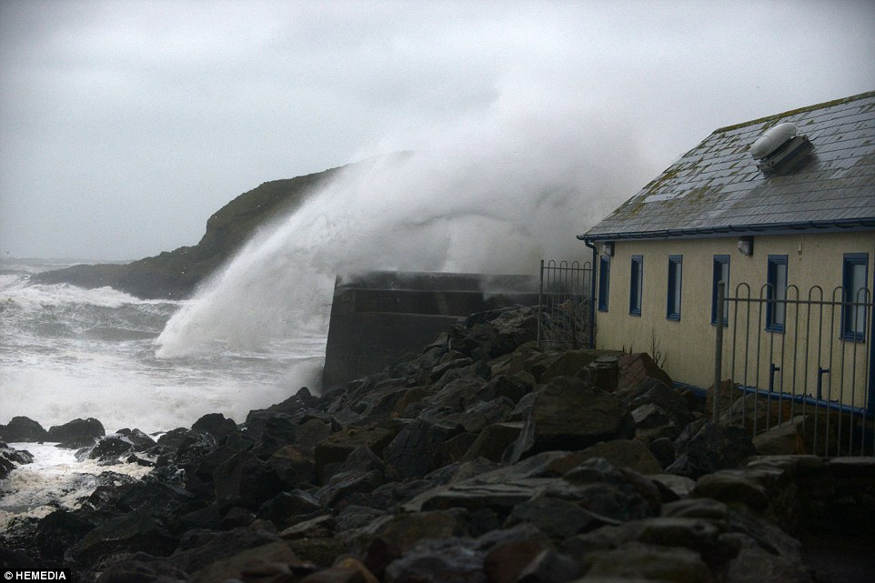Calamity castle: Queen's neighbour flees 450-year-old home next to Balmoral which was left teetering on brink by rising flood waters as storms uncover 130-year-old ship wreck off Cornish coast