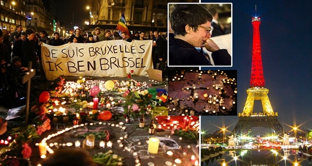 A world united in grief: Brussels residents hold sombre candle-lit vigils around floral tributes as famous landmarks around the globe are lit up with colours of Belgian flag