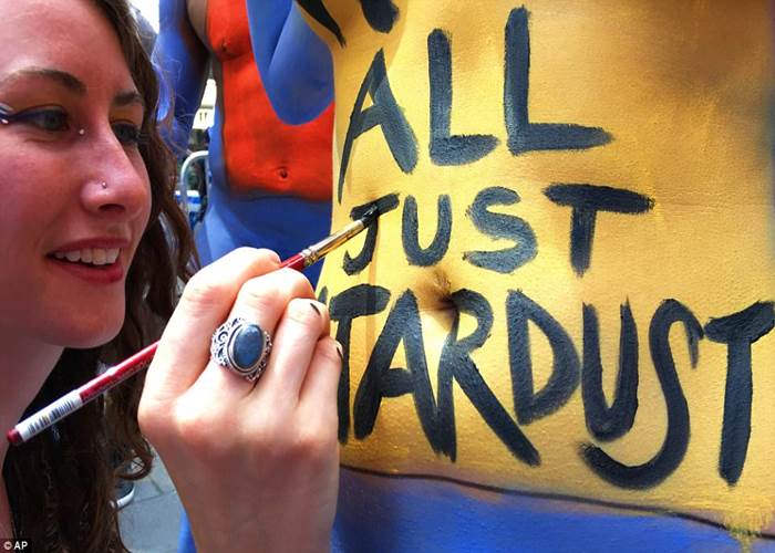 Hundreds of models pose NAKED in Times Square to 'promote positivity and acceptance'